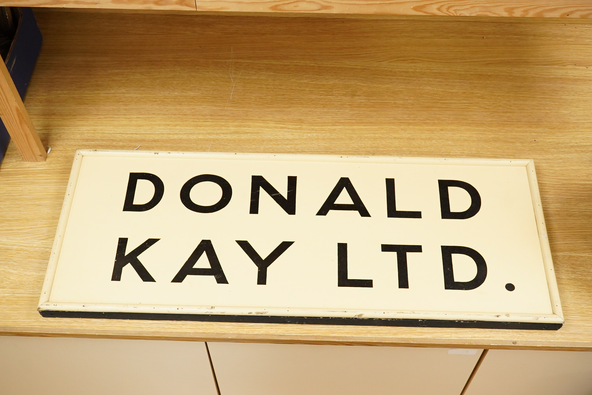 Three wooden signs, one a Metro sign, another First Floor offices, the other Donald Kay Ltd. Metro- 98cm